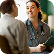 Female patient and a doctor talking in hospital